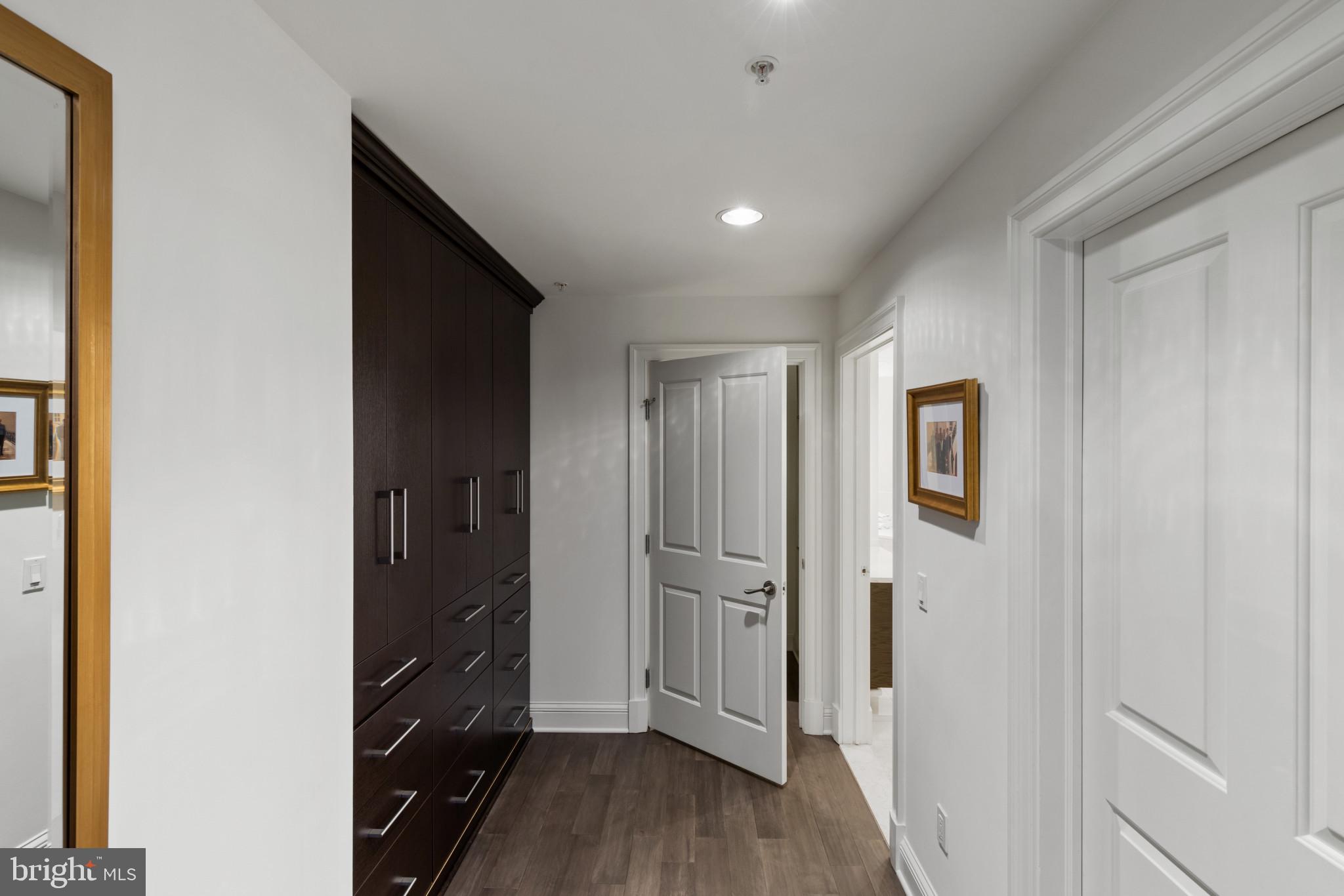 801 Key Highway, Unit 110 Baltimore, MD 21230 - Photo 39 of 78 a view of a hallway with wooden floor