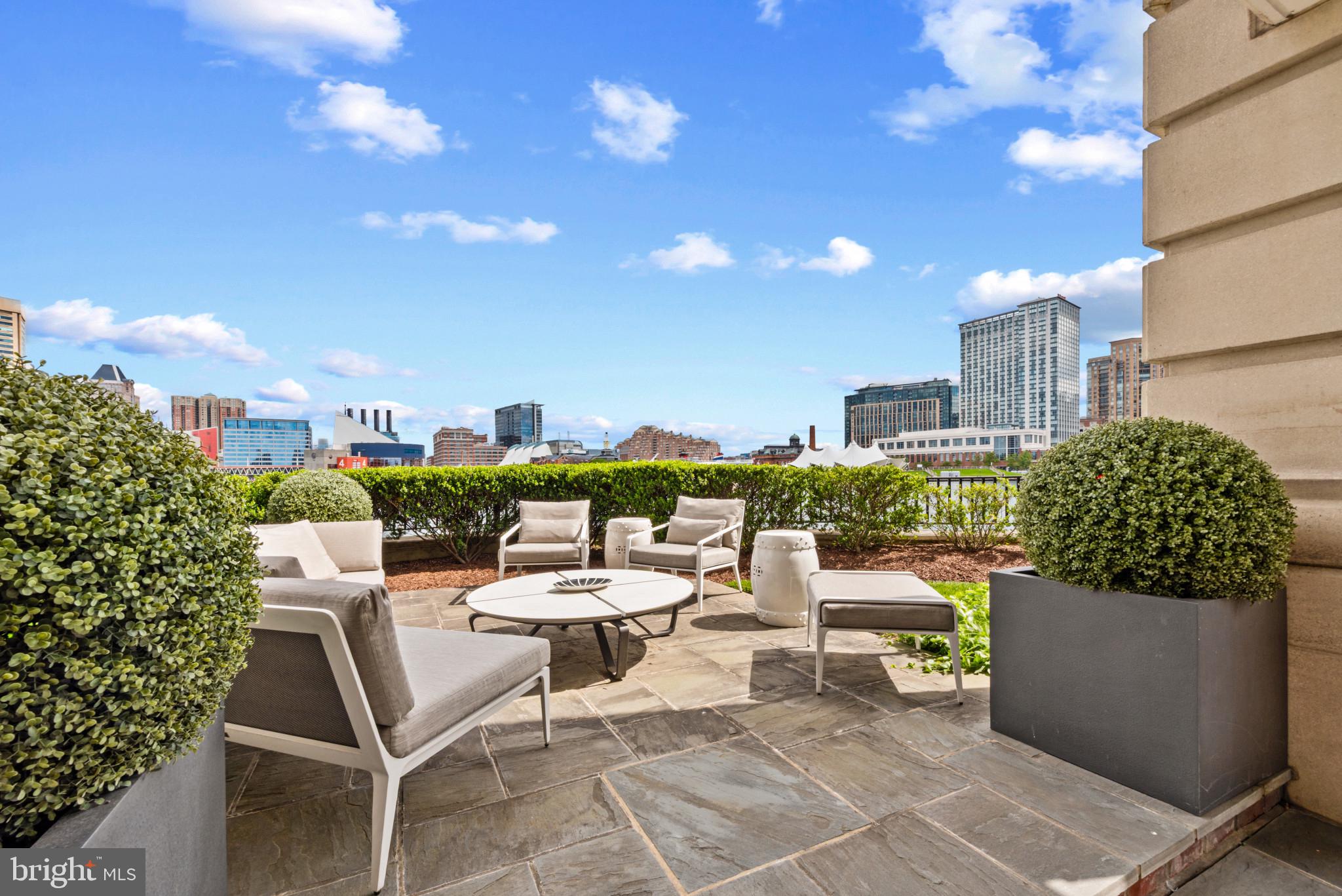 801 Key Highway, Unit 110 Baltimore, MD 21230 - Photo 49 of 78 a view of a terrace with sitting area