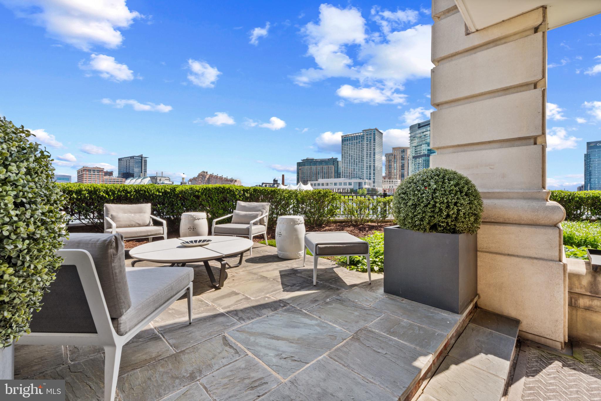 801 Key Highway, Unit 110 Baltimore, MD 21230 - Photo 50 of 78 a balcony with outdoor seating and plants