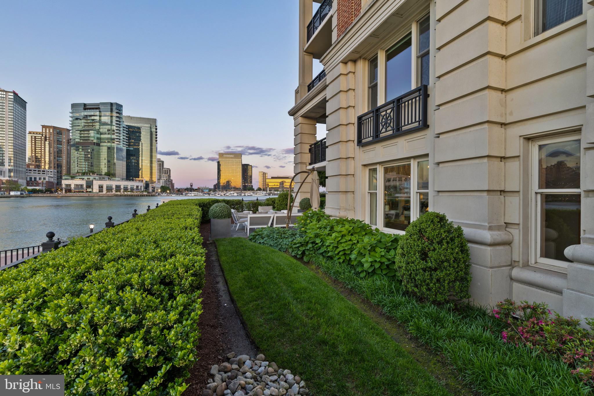 801 Key Highway, Unit 110 Baltimore, MD 21230 - Photo 61 of 78 a view of a city with tall buildings and a big yard