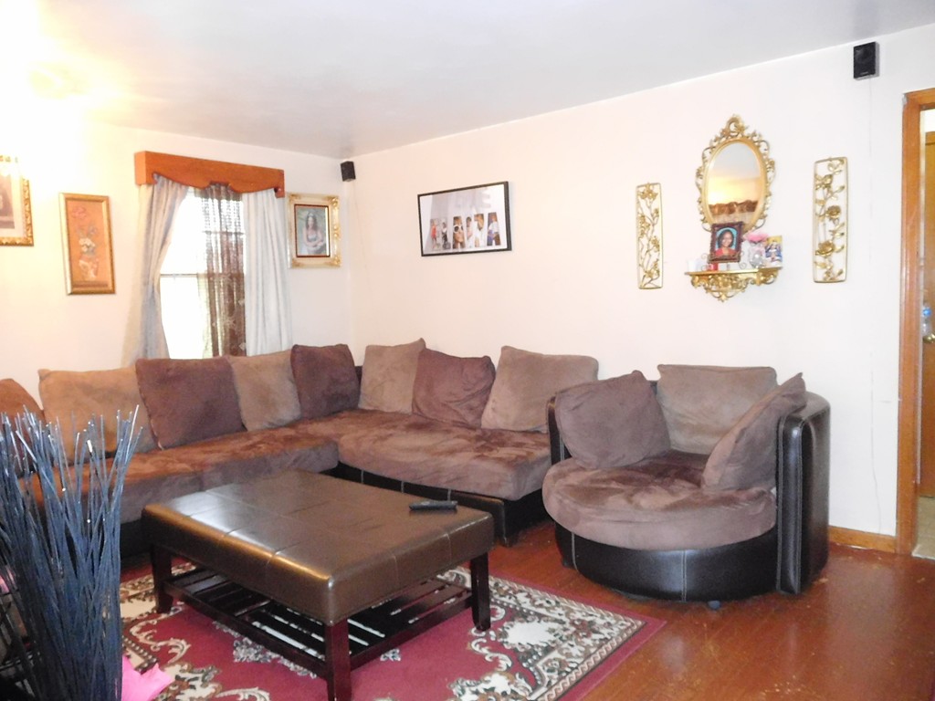 177 Gilbert Avenue Springfield, MA 01119 - Photo 4 of 13 a living room with furniture and a large window