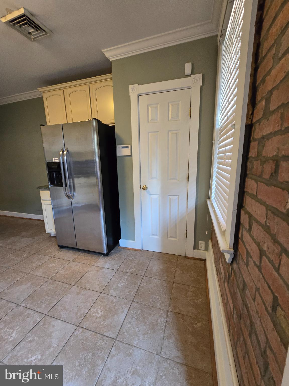 126 East 7th Street Frederick, MD 21701 - Photo 4 of 9 Modern kitchen with charming brick accents.