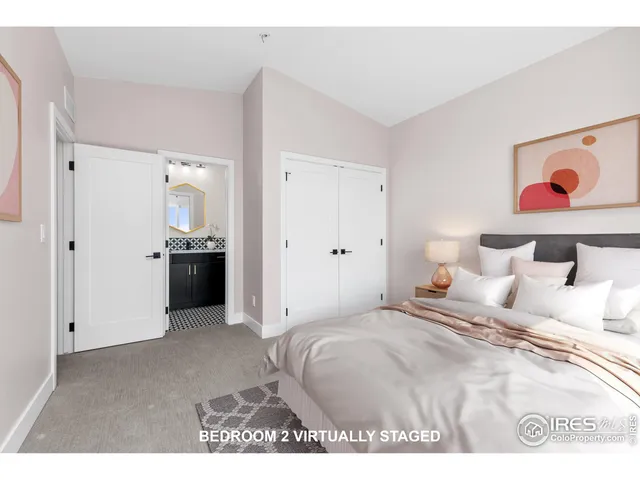 a bedroom with a bed and a cabinets