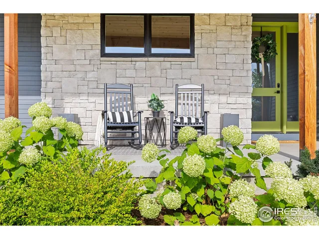 a front view of a house with outdoor seating