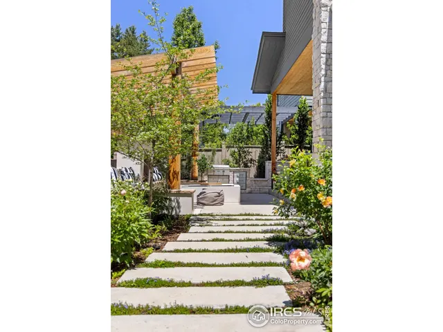 a view of a building with a garden and plants