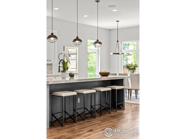 a kitchen with a table and chairs