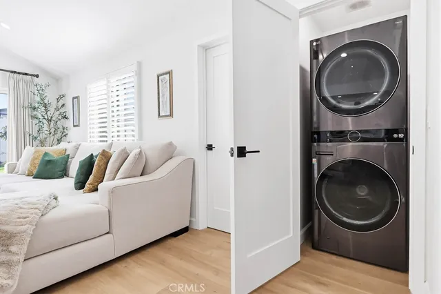 a living room with furniture and a washing machine