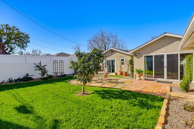 a house view with a garden space