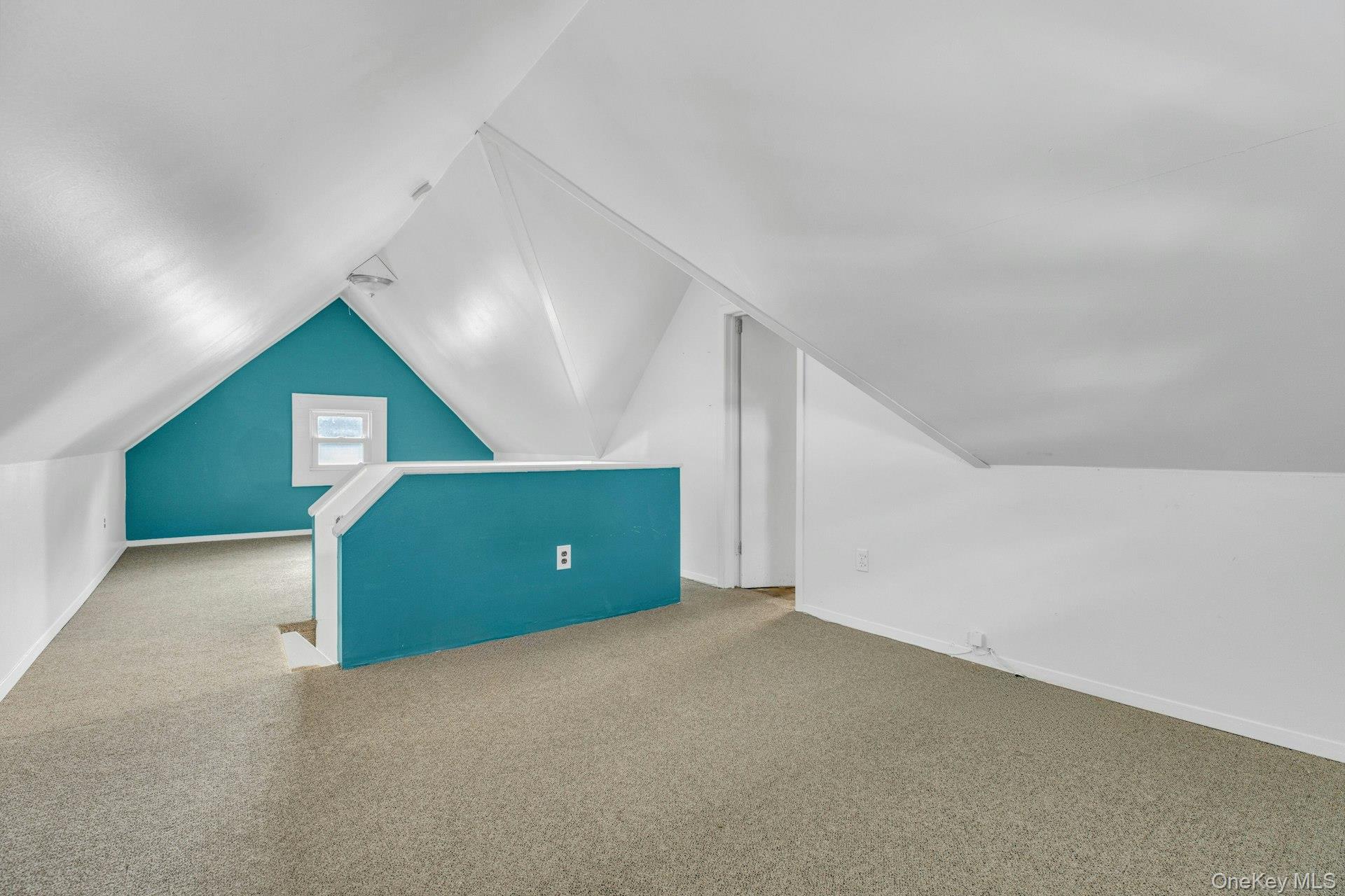 76 Green Street, Unit #2 Huntington, NY 11743 - Photo 21 of 28 a view of an empty room with a window