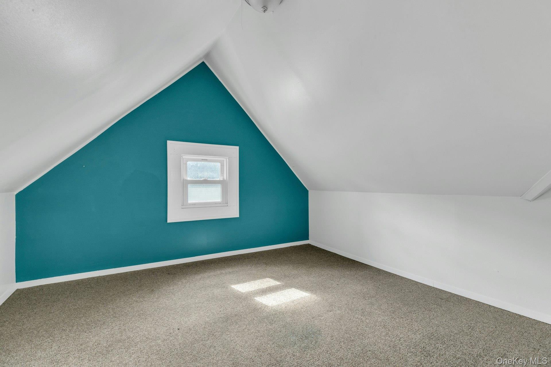 76 Green Street, Unit #2 Huntington, NY 11743 - Photo 23 of 28 a view of an empty room with a window