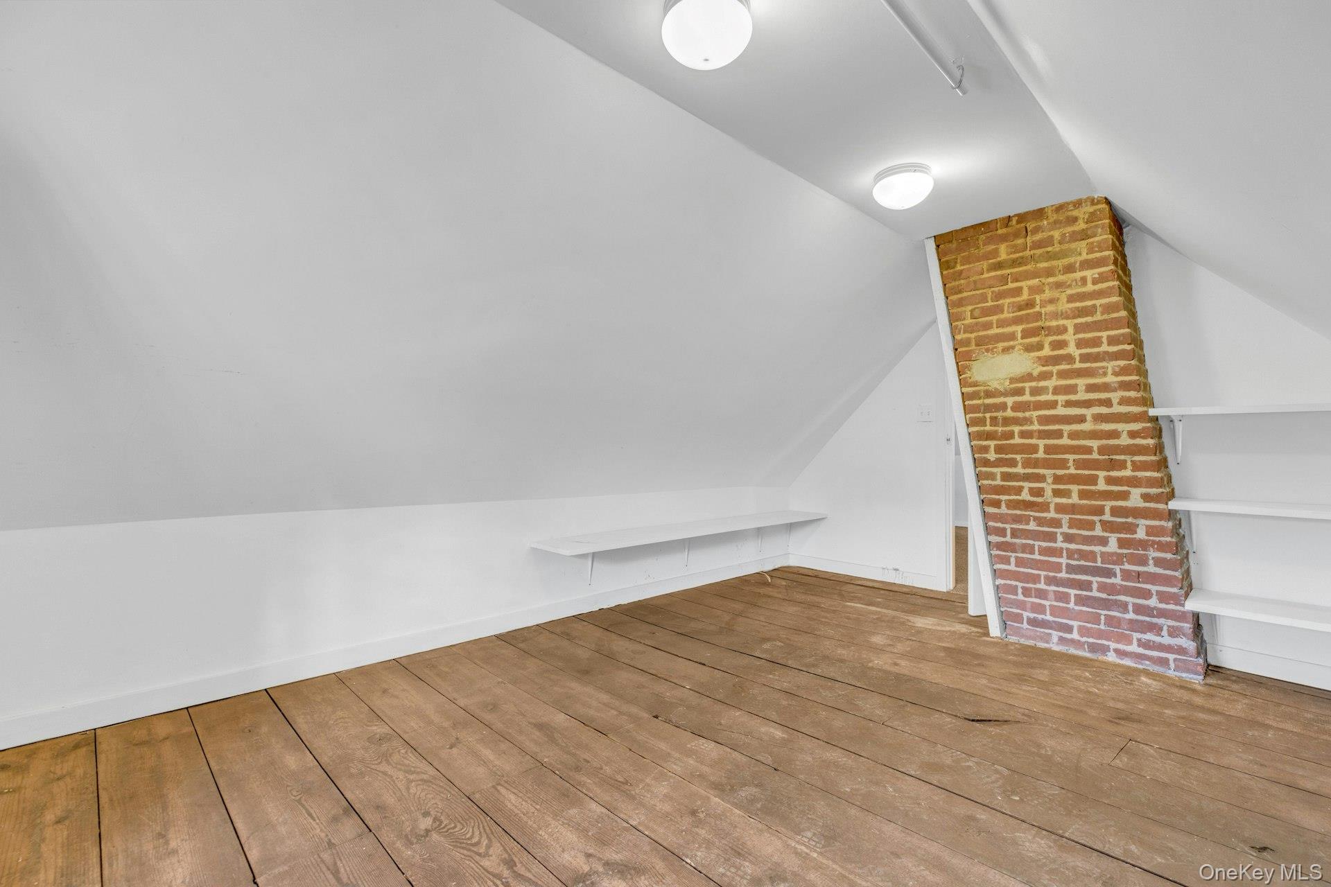 76 Green Street, Unit #2 Huntington, NY 11743 - Photo 25 of 28 a view of empty room with wooden floor