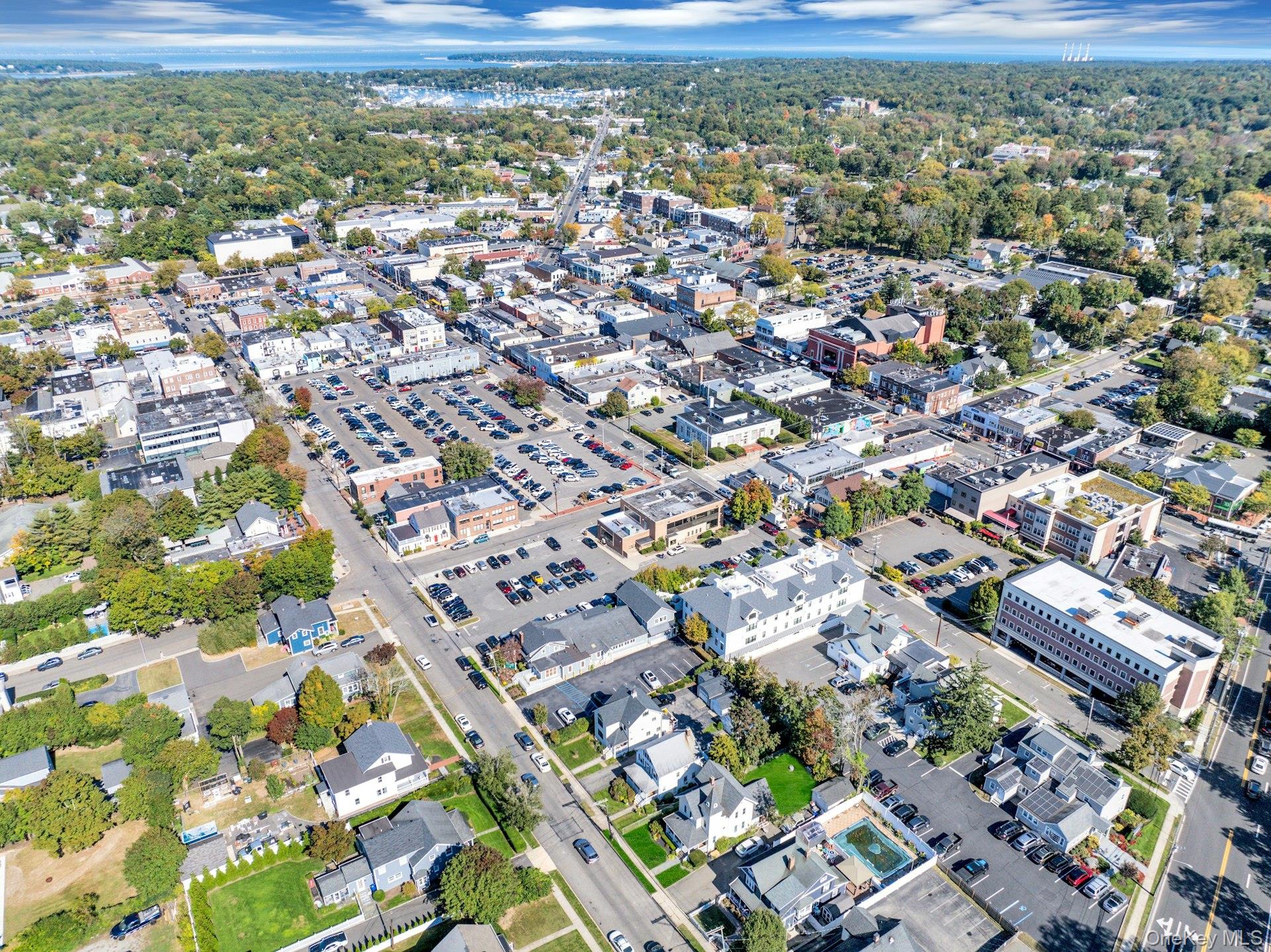 76 Green Street, Unit #2 Huntington, NY 11743 - Photo 26 of 28 an aerial view of residential houses with outdoor space
