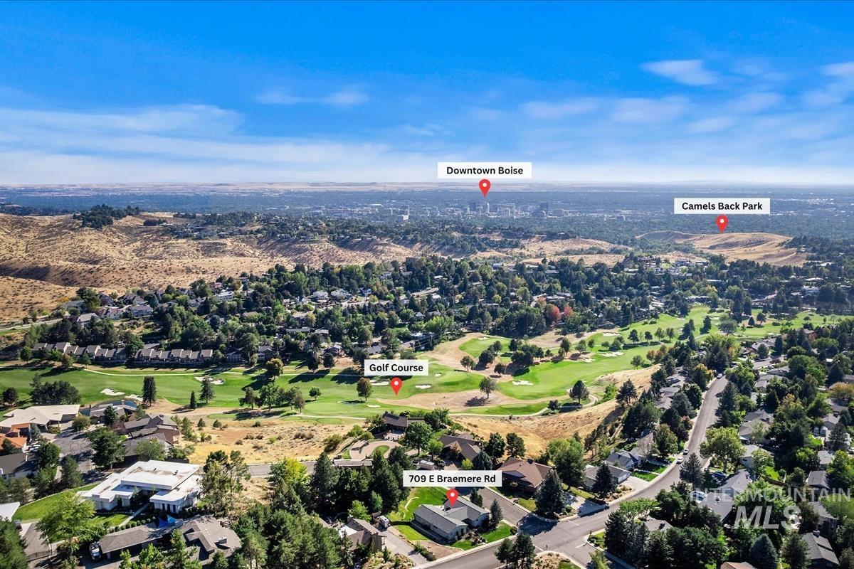 709 East Braemere Road Boise, ID 83702 - Photo 40 of 50 Aerial perspective showcasing residential properties, a golf course, and distant urban areas