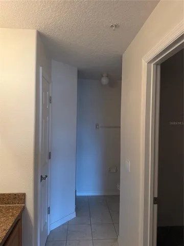 an aerial view of a houses with a swimming pool