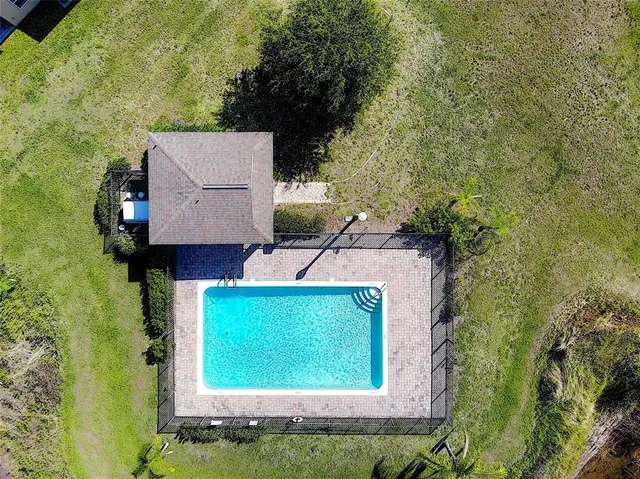 a street sign that is sitting in front of flowers
