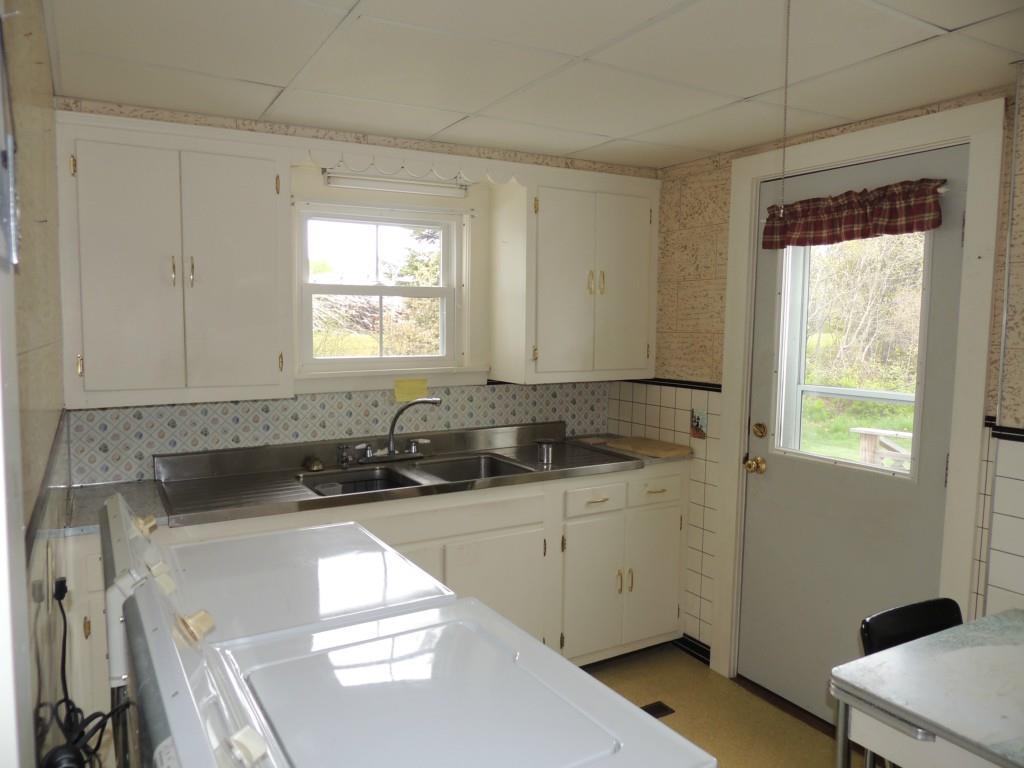 19 Eggemoggin Road Little Deer Isle, ME 04650 - Photo 8 of 24 Kitchen door leads to back deck and...
