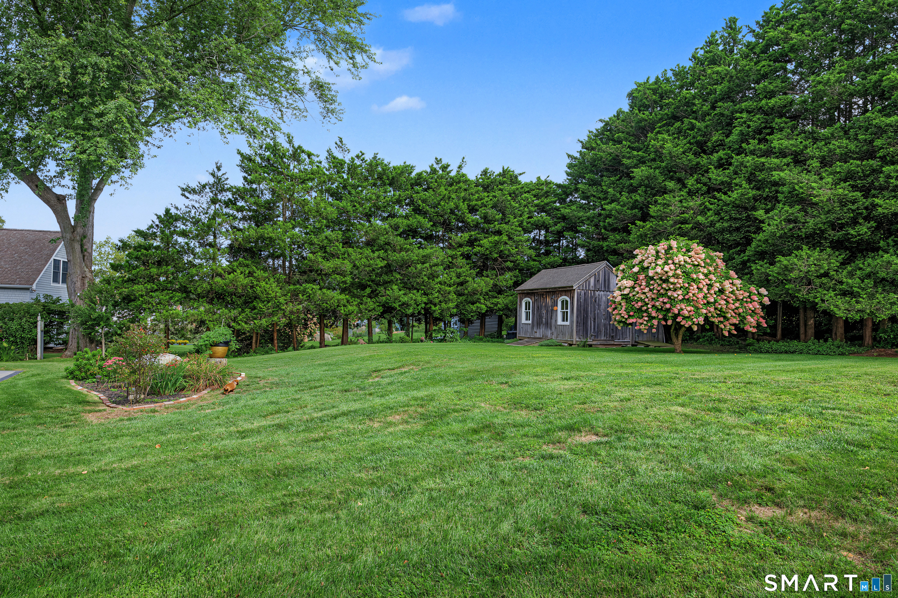 64 Old Black Point Road East Lyme, CT 06357 - Photo 29 of 35 Large back yard includes a masterfully built storage shed.