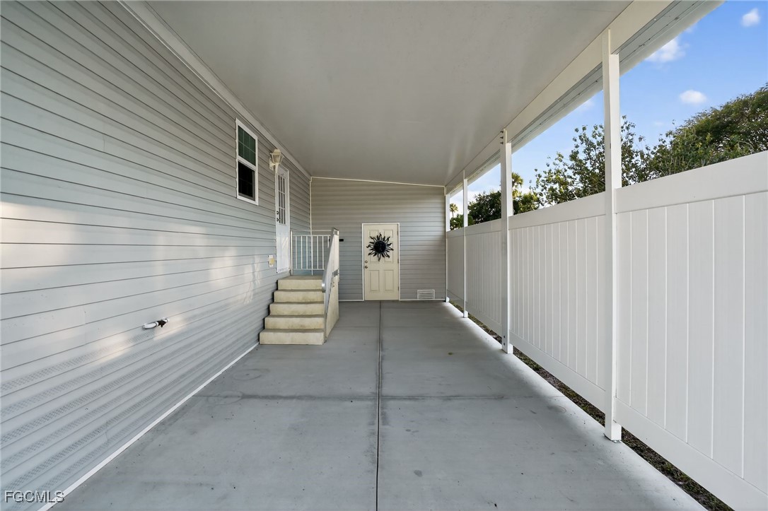 516 Menton Lane Naples, FL 34112 - Photo 24 of 34 a view of a porch with stairs