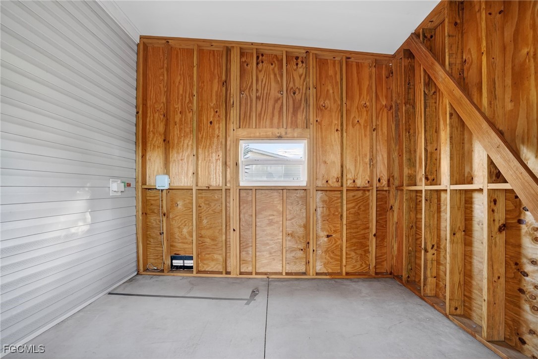 516 Menton Lane Naples, FL 34112 - Photo 25 of 34 an entryway with wooden walls