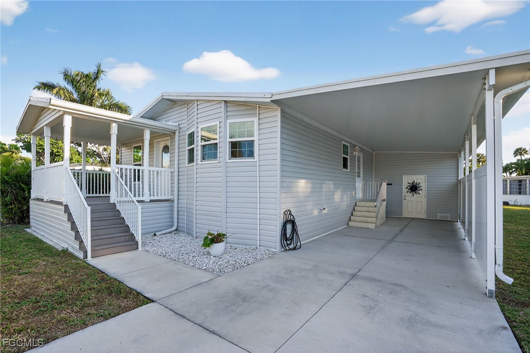 516 Menton Lane Naples, FL 34112 - Photo 26 of 34 a view of a house with a patio