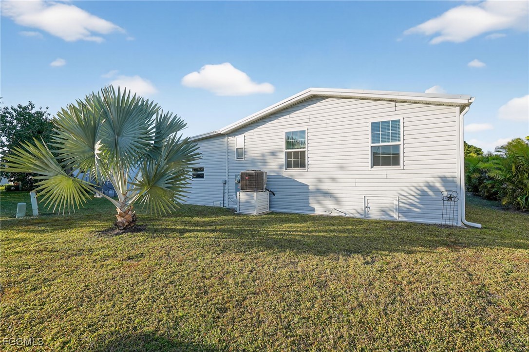 516 Menton Lane Naples, FL 34112 - Photo 27 of 34 a view of a house with a yard