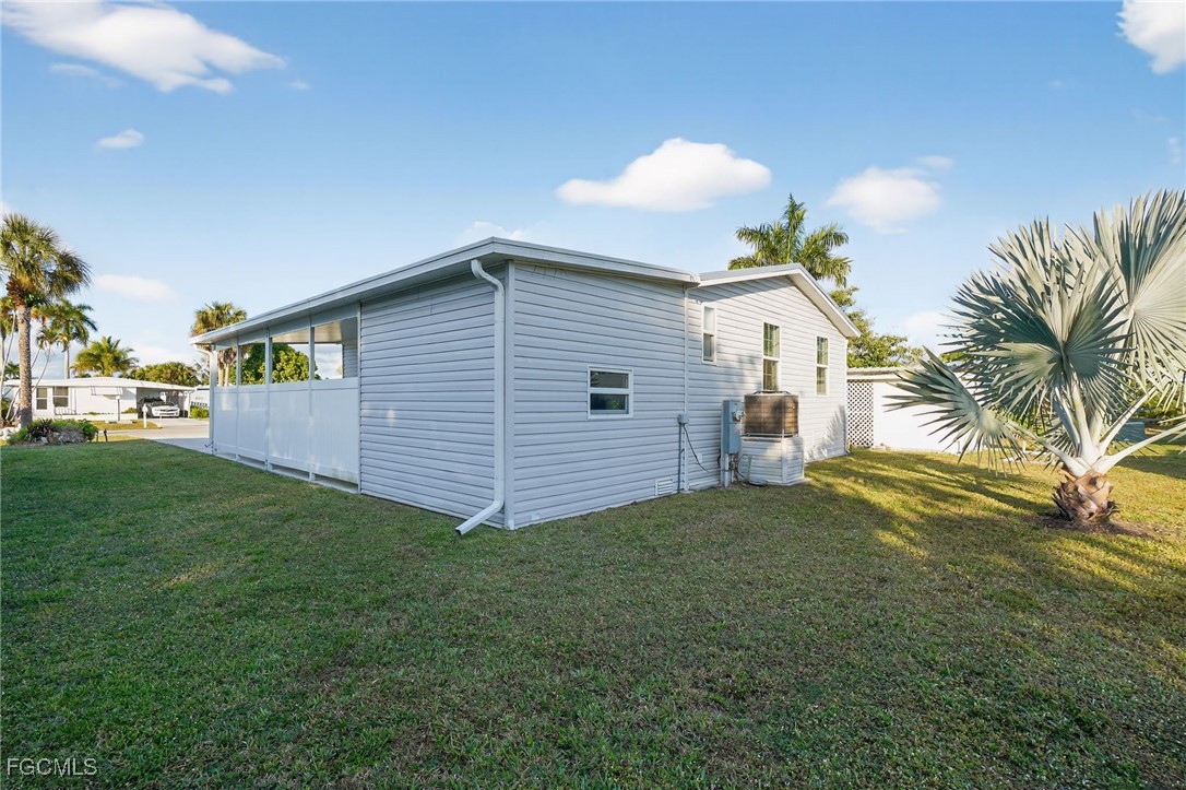 516 Menton Lane Naples, FL 34112 - Photo 28 of 34 a view of a house with a backyard