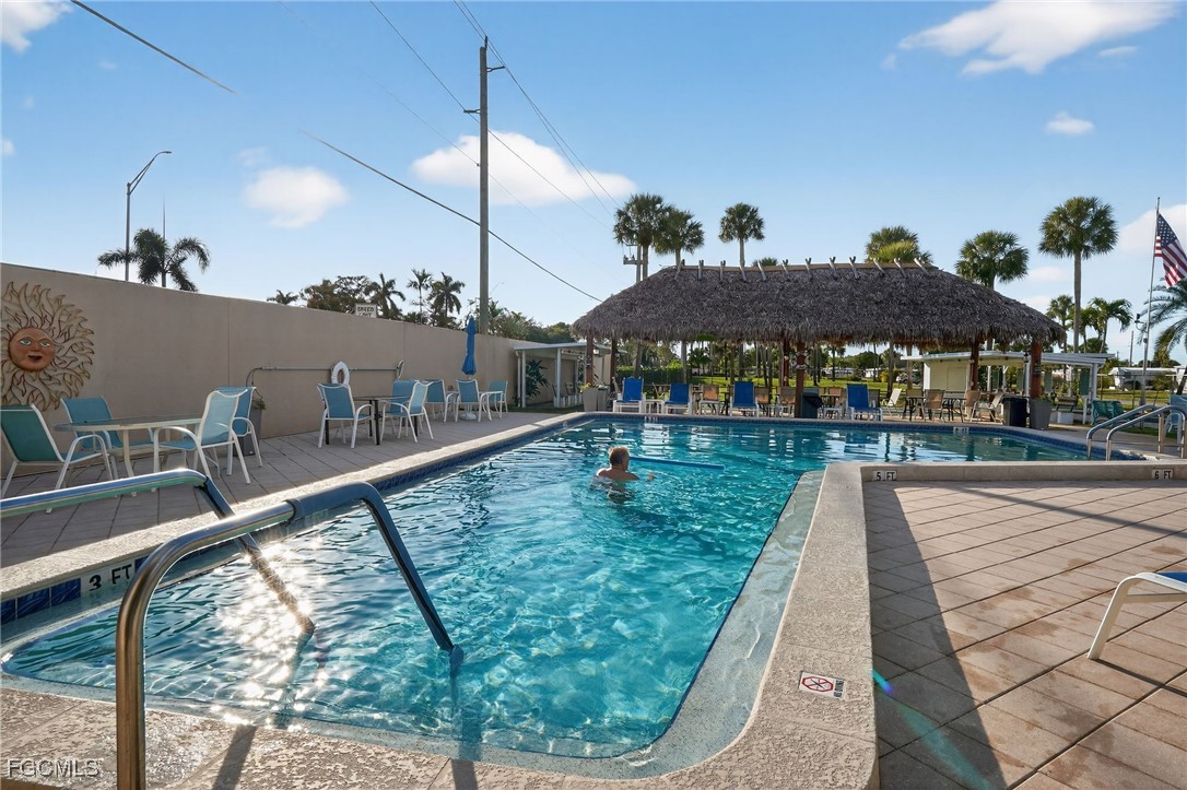 516 Menton Lane Naples, FL 34112 - Photo 30 of 34 a view of swimming pool from a balcony