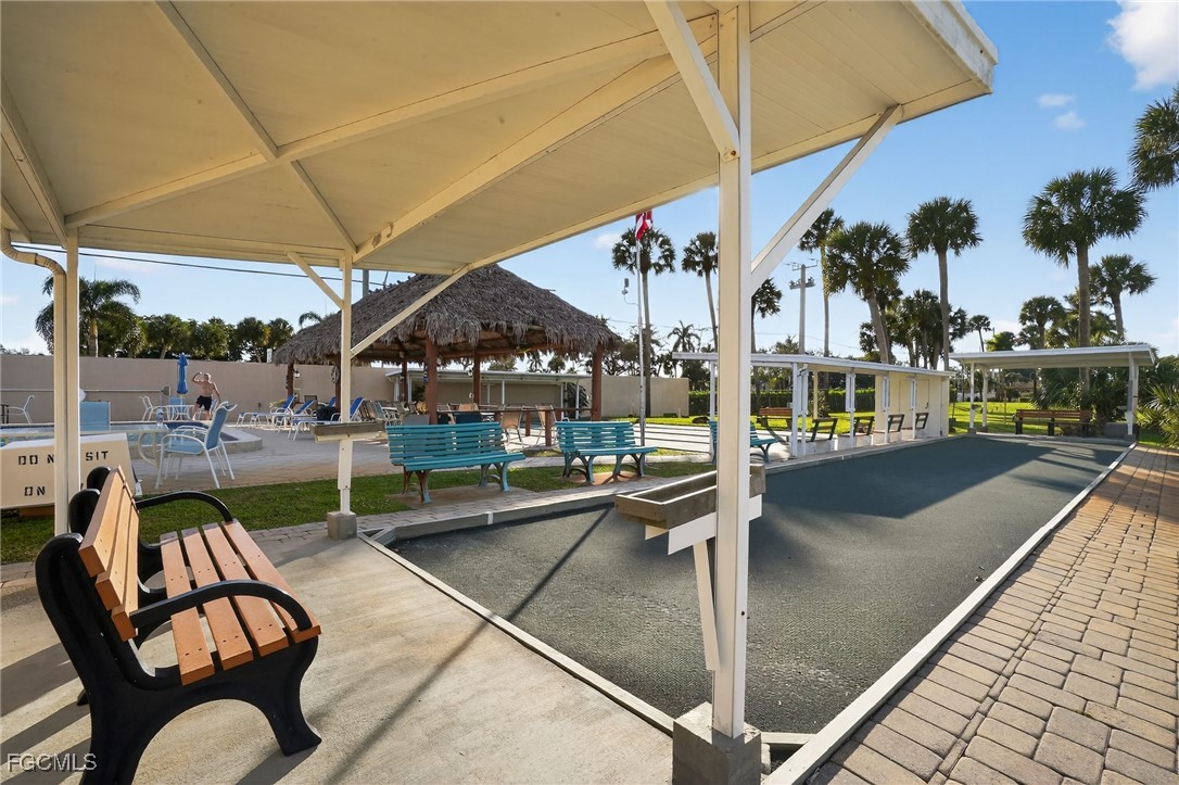 516 Menton Lane Naples, FL 34112 - Photo 32 of 34 a view of swimming pool with outdoor seating