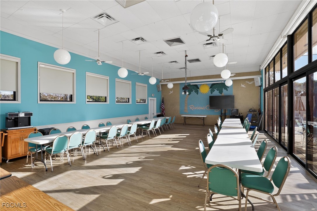516 Menton Lane Naples, FL 34112 - Photo 33 of 34 a lobby with table and chairs