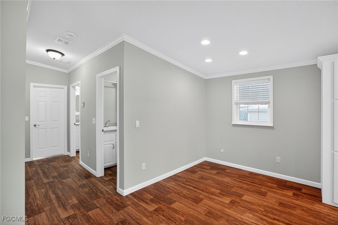 516 Menton Lane Naples, FL 34112 - Photo 8 of 34 a view of a livingroom with wooden floor