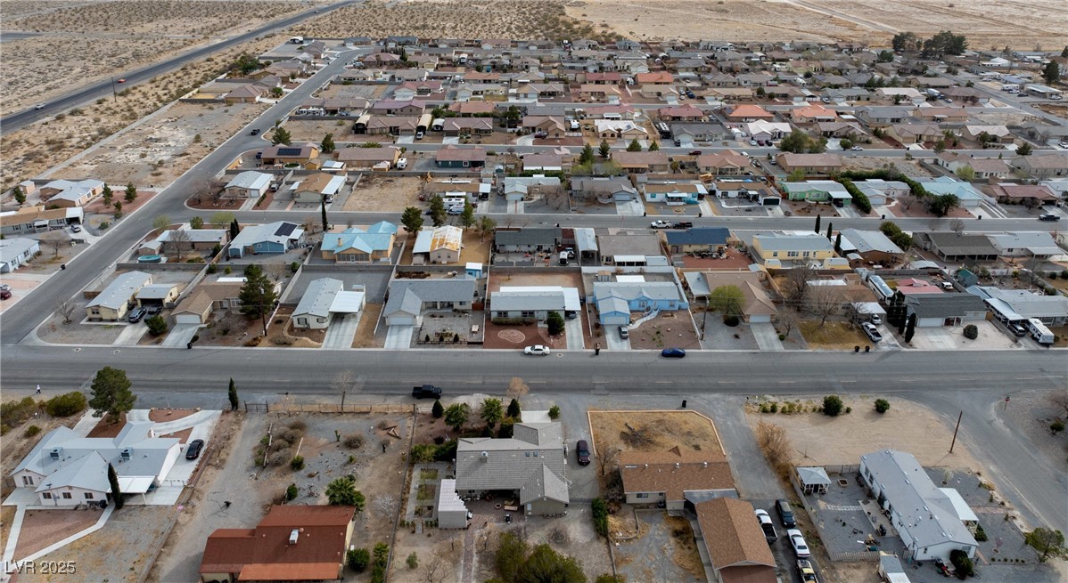 633 East Simkins Road Pahrump, NV 89060 - Photo 23 of 25 Drone / aerial view featuring a residential view