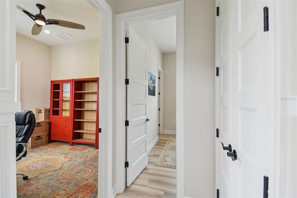 13711 Lussier Lane Spring Hill, FL 34610 - Photo 11 of 100 a view of a hallway with closet and cabinet