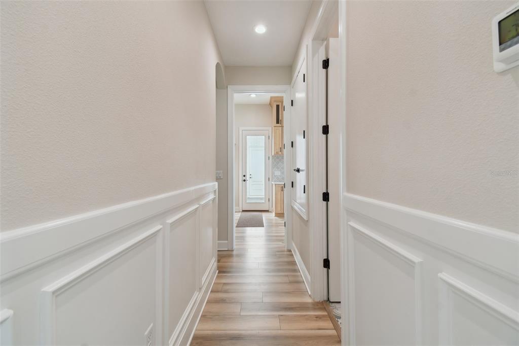 13711 Lussier Lane Spring Hill, FL 34610 - Photo 13 of 100 a view of a hallway with wooden floor and entryway