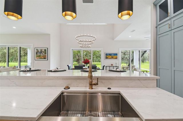 a bathroom with a granite countertop sink a mirror a shower and a bathtub