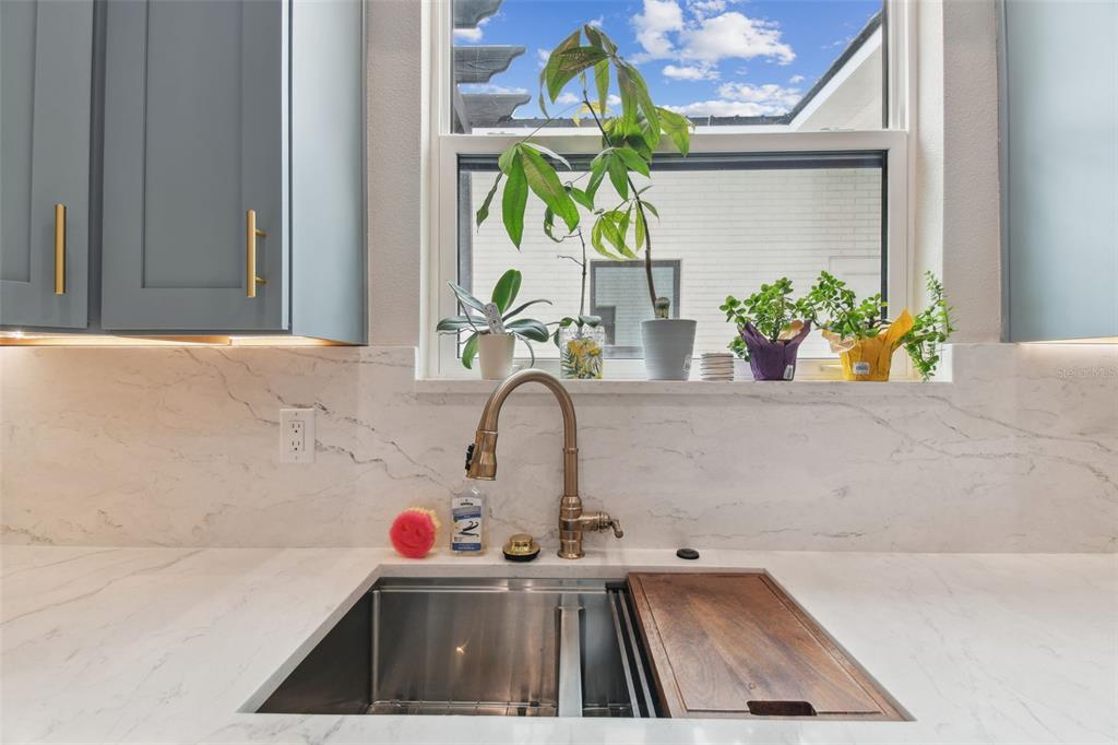 13711 Lussier Lane Spring Hill, FL 34610 - Photo 49 of 100 a bathroom with a sink and a window