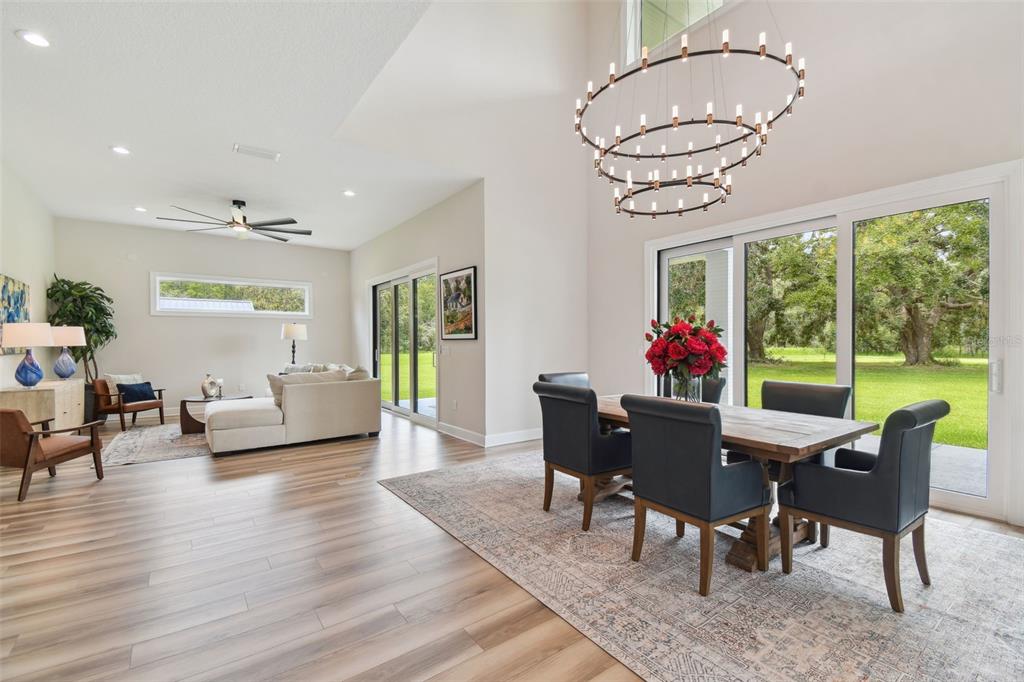 13711 Lussier Lane Spring Hill, FL 34610 - Photo 51 of 100 a view of a dining room with furniture window and wooden floor