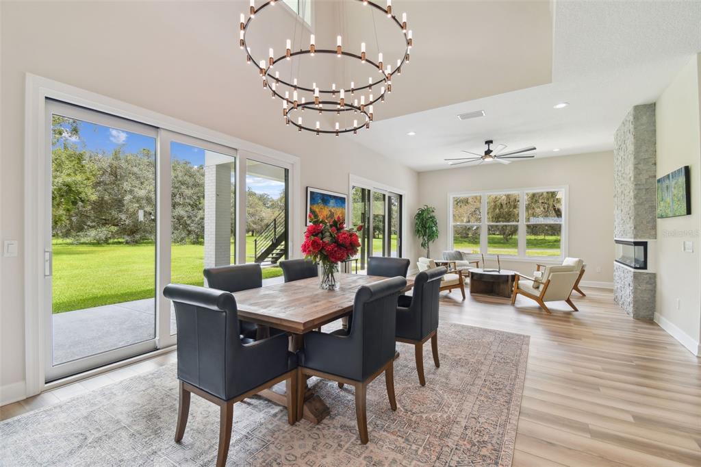 13711 Lussier Lane Spring Hill, FL 34610 - Photo 53 of 100 a view of a dining room with furniture window and outside view