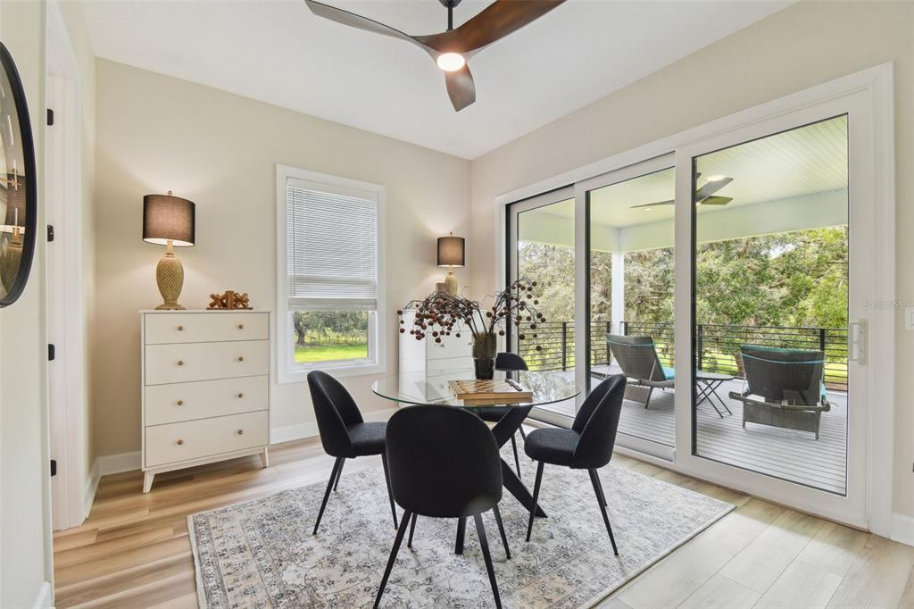 13711 Lussier Lane Spring Hill, FL 34610 - Photo 73 of 100 a dining room with furniture and a window