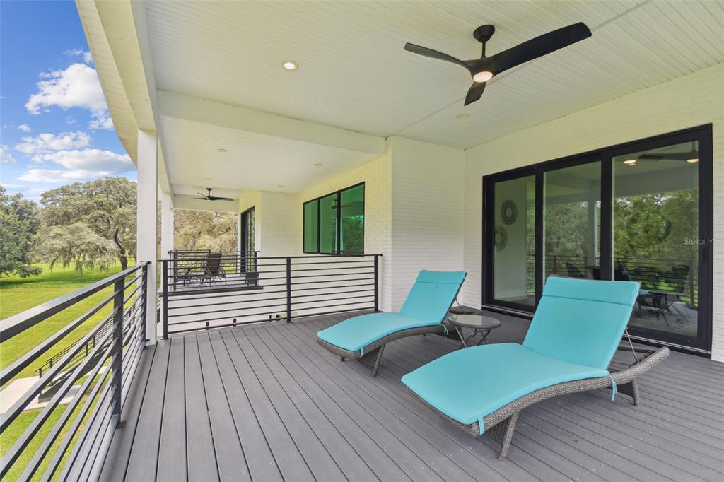 13711 Lussier Lane Spring Hill, FL 34610 - Photo 77 of 100 a view of a porch with furniture and a yard