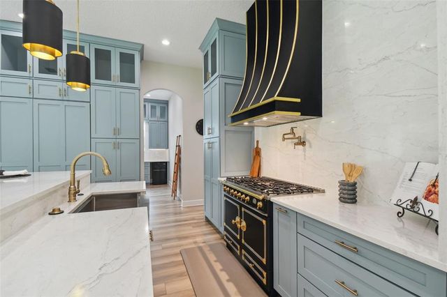 a view of house with swimming pool and yard