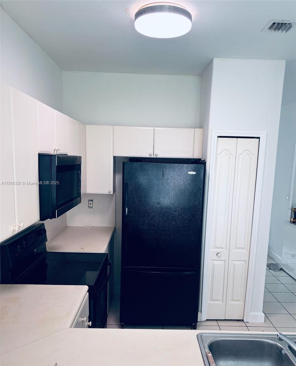 1663 Southeast 29th Street, Unit 100 Homestead, FL 33035 - Photo 5 of 15 a bathroom with a sink and a mirror