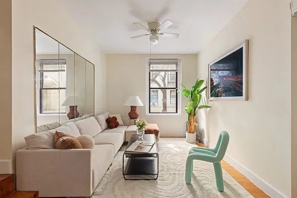 a living room with furniture and a window