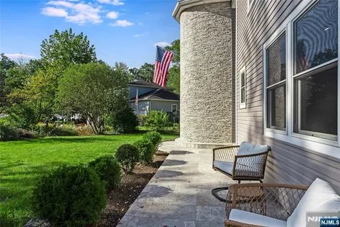 a view of a bench in the backyard
