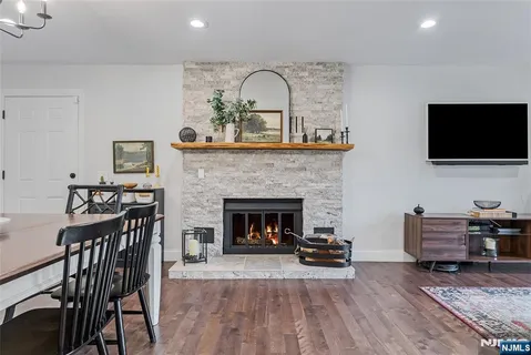 a living room with furniture fireplace and flat screen tv