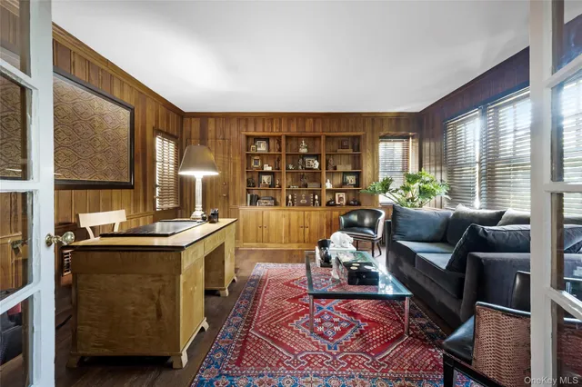 a living room with furniture and large window