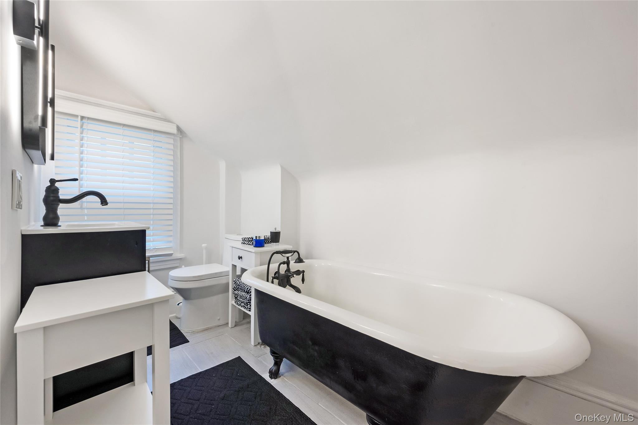 60 Aberfoyle Road New Rochelle, NY 10804 - Photo 18 of 26 a bathroom with a sink and a toilet