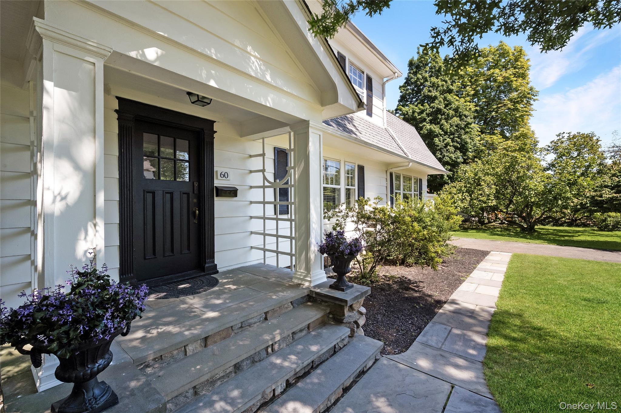 60 Aberfoyle Road New Rochelle, NY 10804 - Photo 2 of 26 a front view of a house with a yard