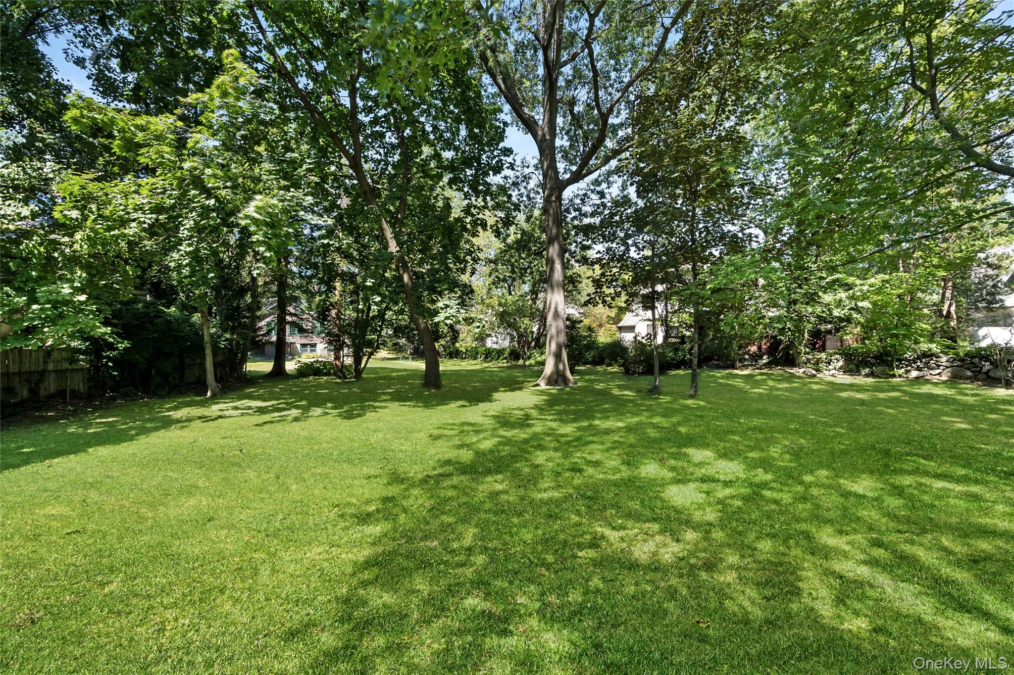 60 Aberfoyle Road New Rochelle, NY 10804 - Photo 21 of 26 a view of outdoor space with deck and trees