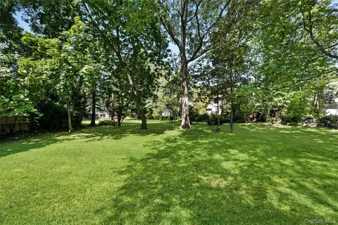 a view of outdoor space with deck and trees