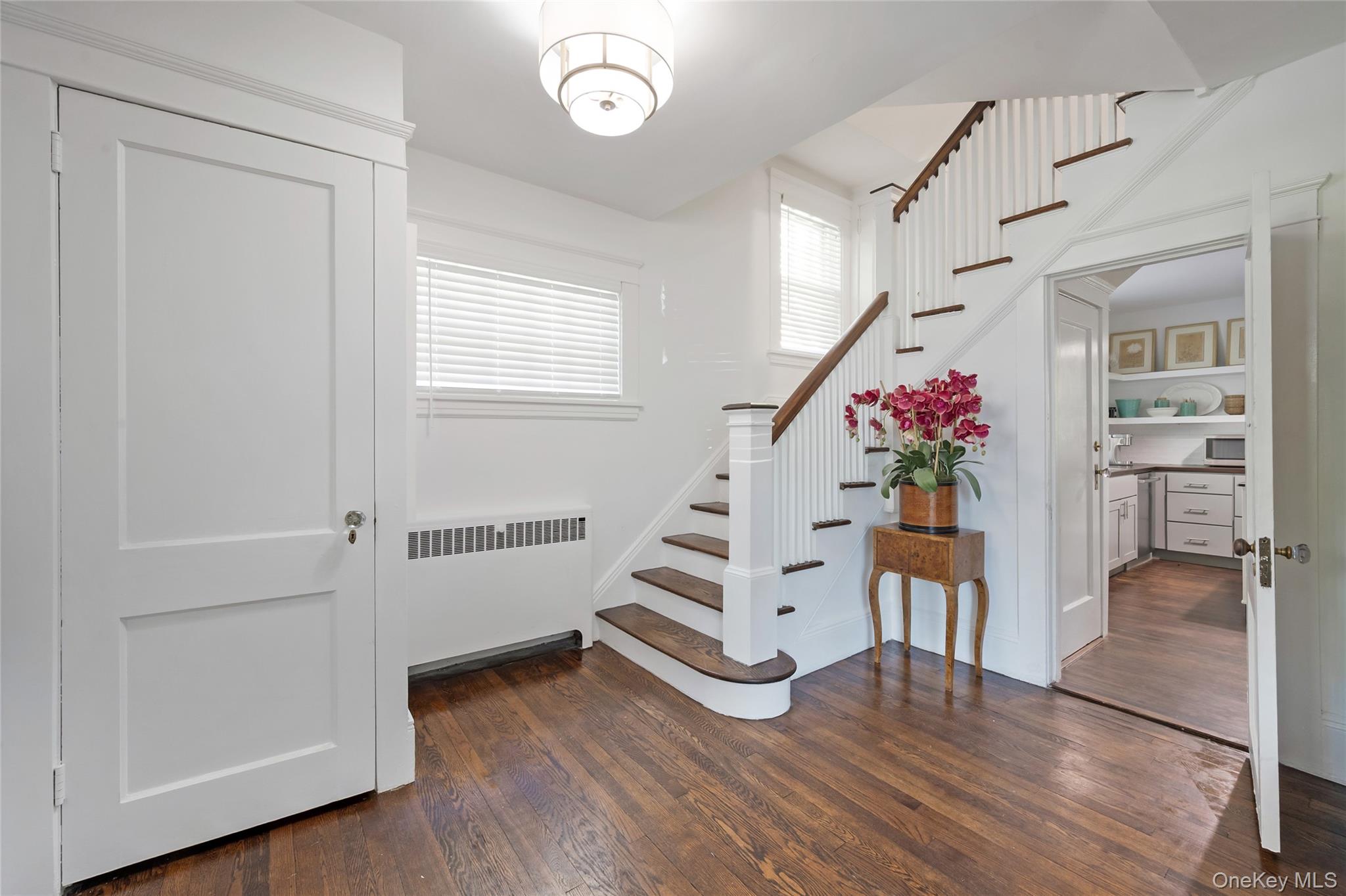 60 Aberfoyle Road New Rochelle, NY 10804 - Photo 3 of 26 a view of a hallway with furniture and wooden floor